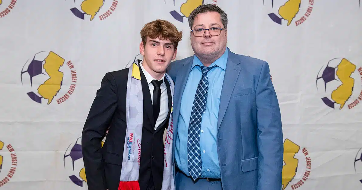 New Jersey ODP player Sandro Cunningham takes a photo with James Galanis, NJYS Director of Technical Operations.