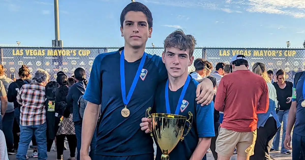 Chase Calemin and Sandro Cunningham pose with the Las Vegas Mayor's Cup trophy.