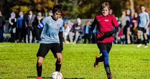 Two Connecticut youth soccer players battle for the ball.