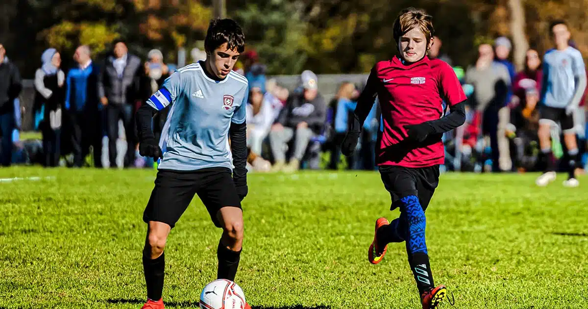 Two Connecticut youth soccer players battle for the ball.