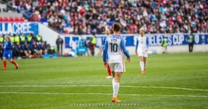 Carli Lloy on the field at Red Bull Arena during SheBelieves Cup.