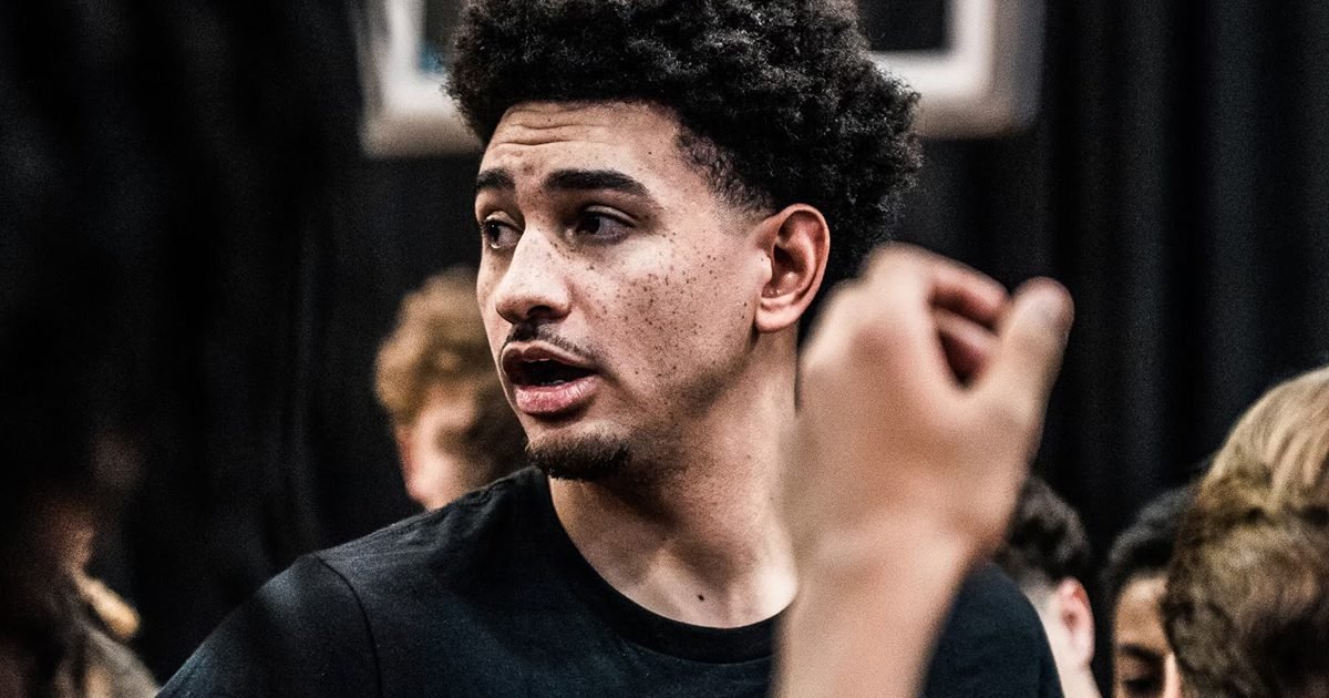 Former Rutgers Basketball captain Geo Baker speaks to a group of youth players.