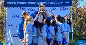 A Connecticut youth soccer team celebrates a State Cup Championship.